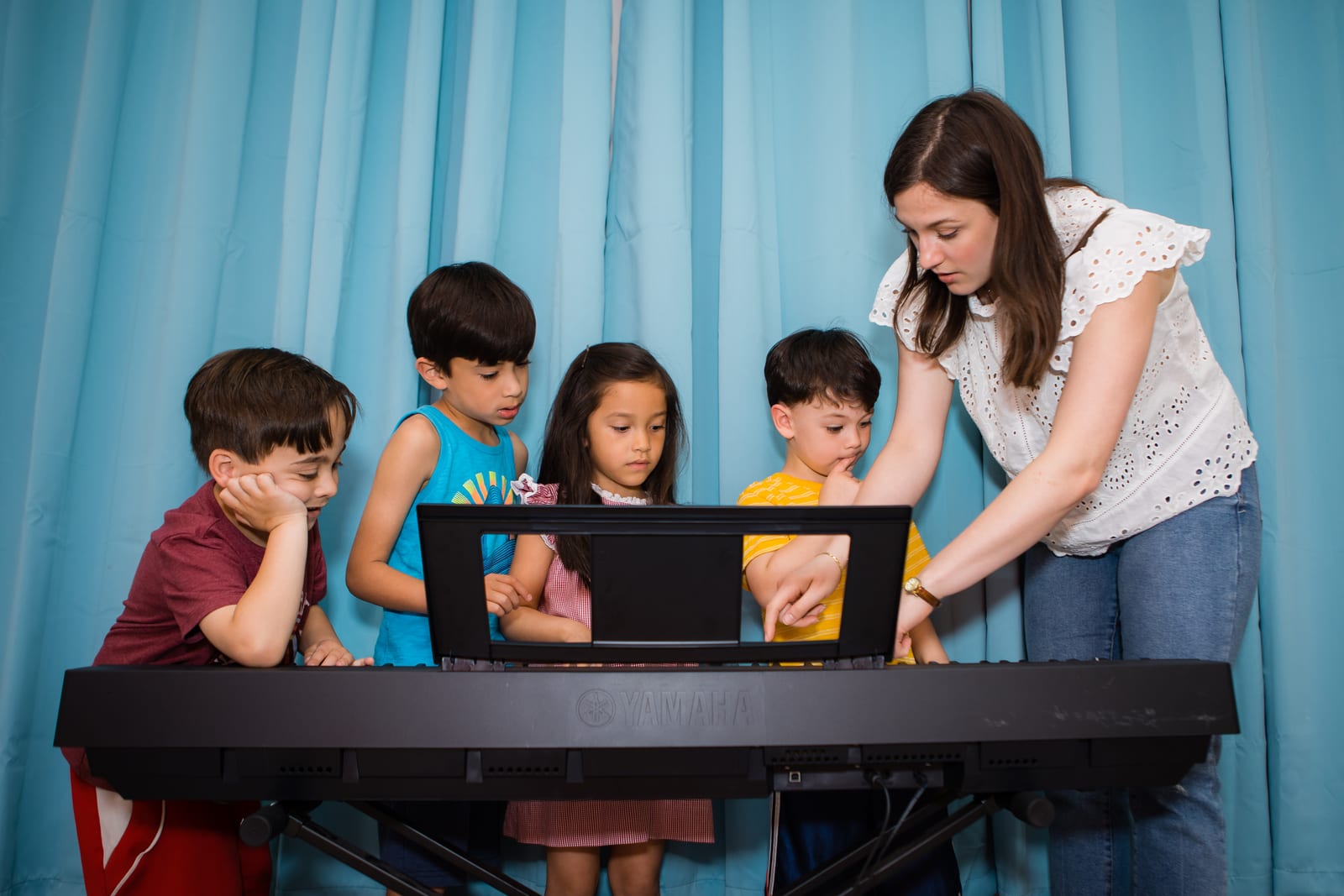 A young Twelve Tone student focused at the keyboard during practice in Glenview, IL.